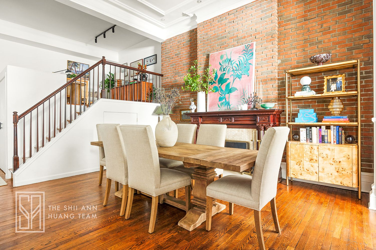 dining area with exposed brick wall