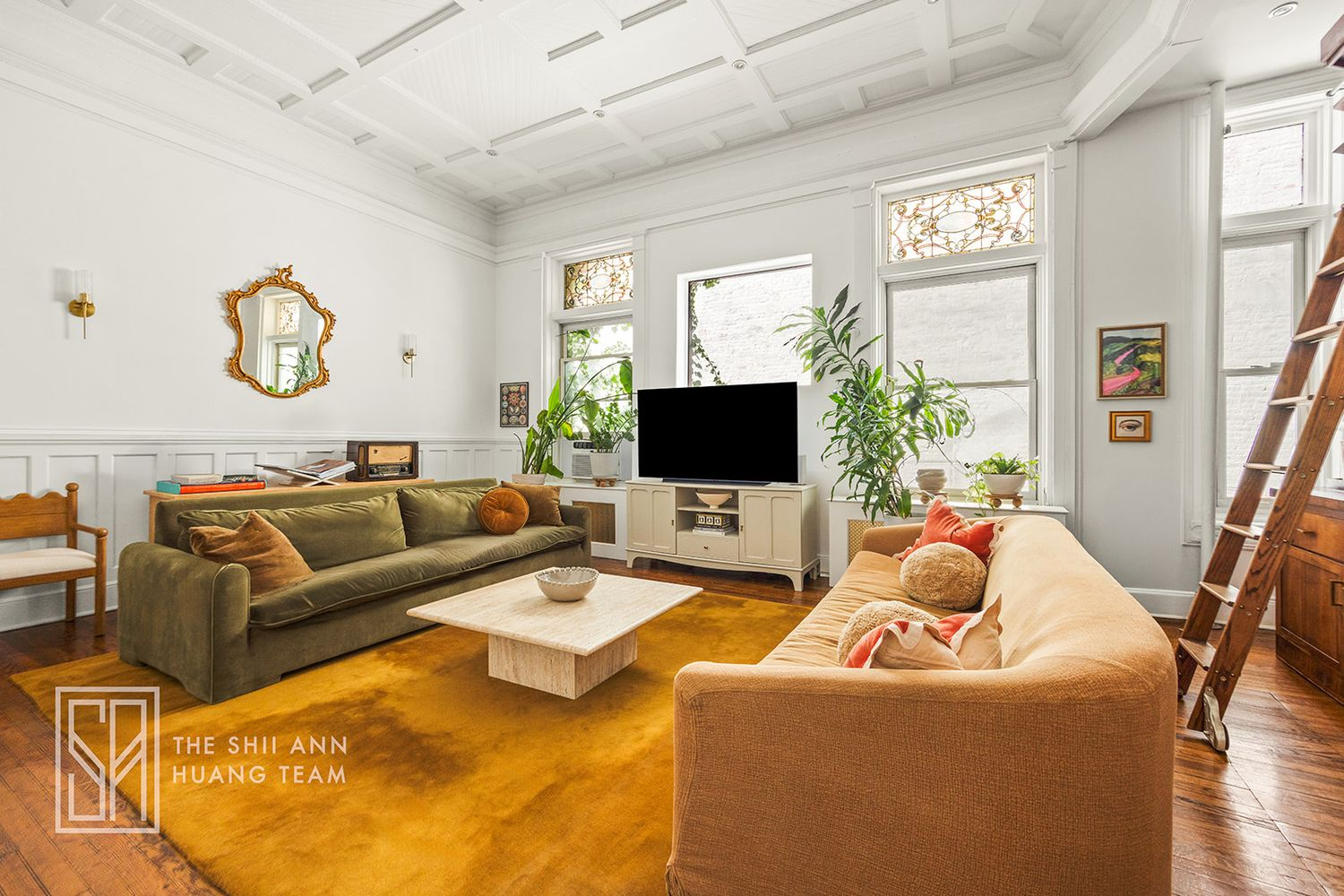 living room with coffered ceiling, wood floor