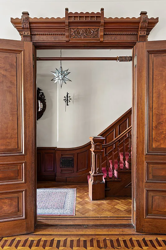 entry with stair with newel post