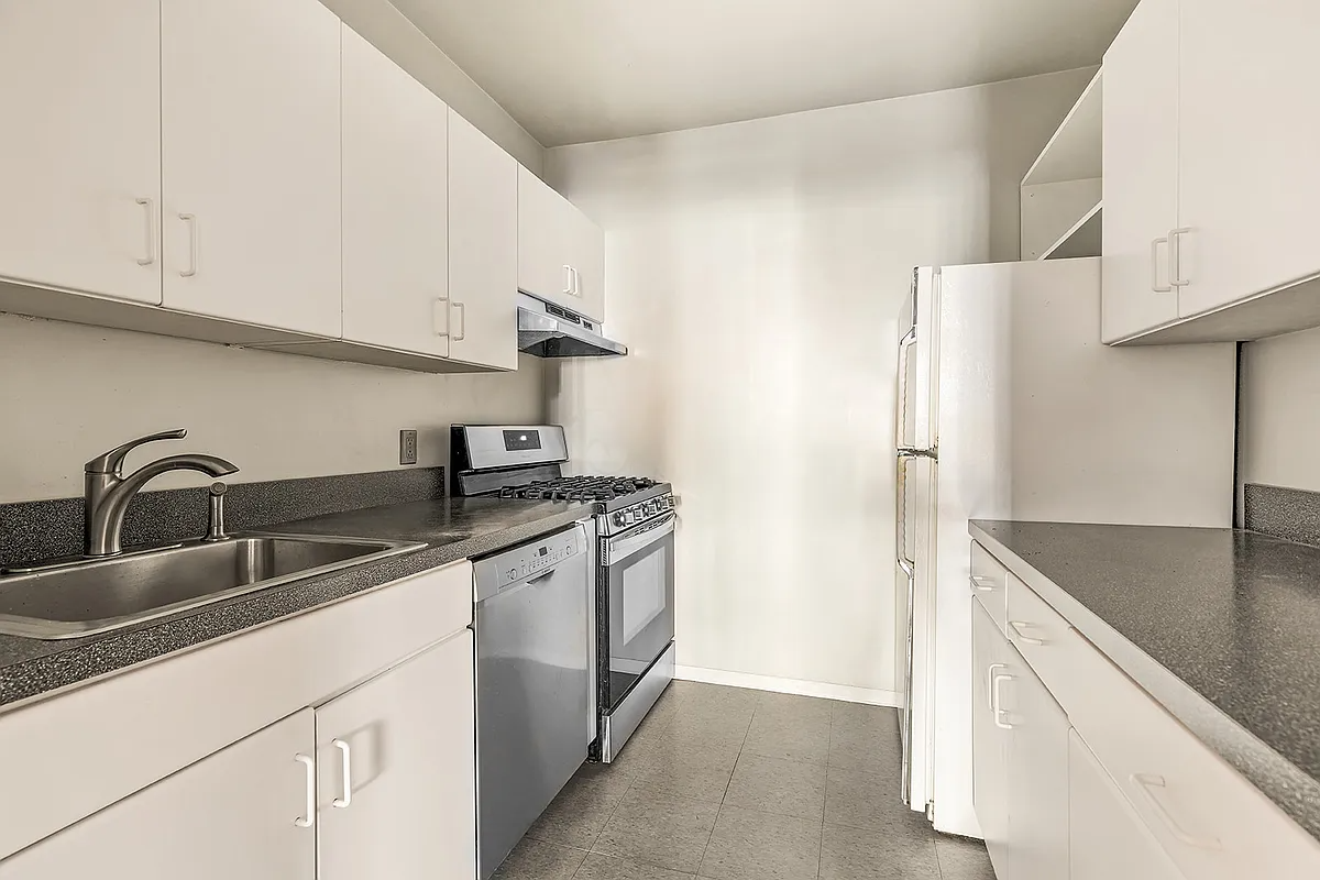 garden level apartment kitchen with white cabinets