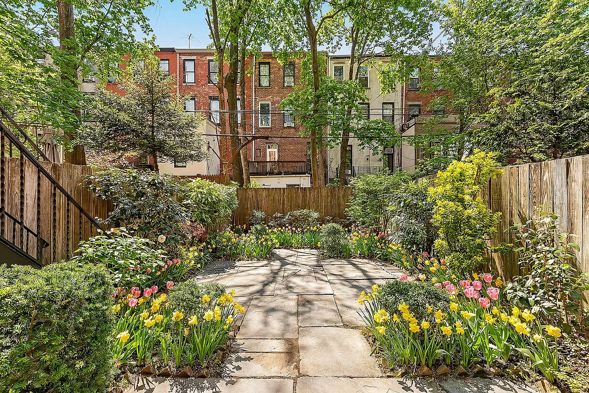 rear yard with spring tulips and daffodils blooming