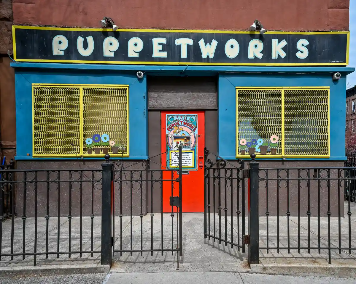 puppet theater exterior with bright red door