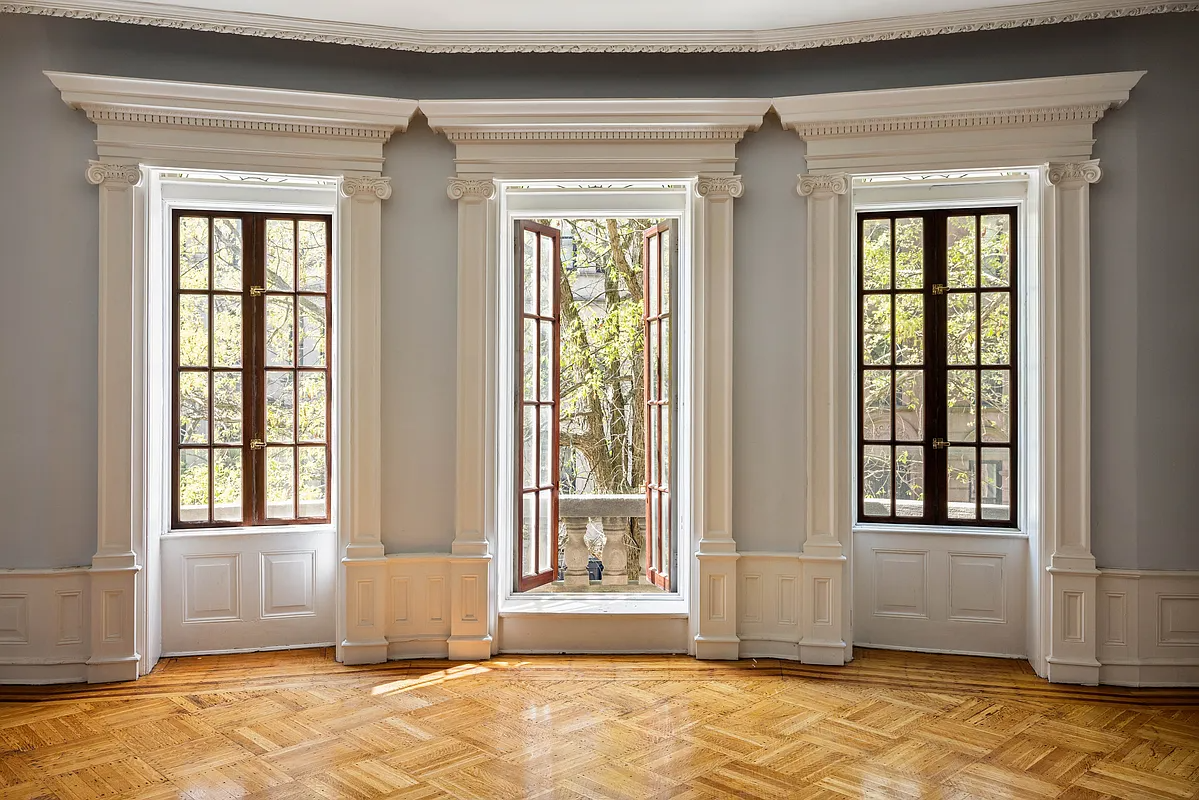 wall of doors and windows with period moldings