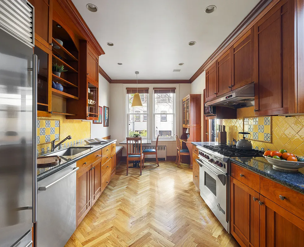 kitchen with wood cabinets, yellow tile backsplash