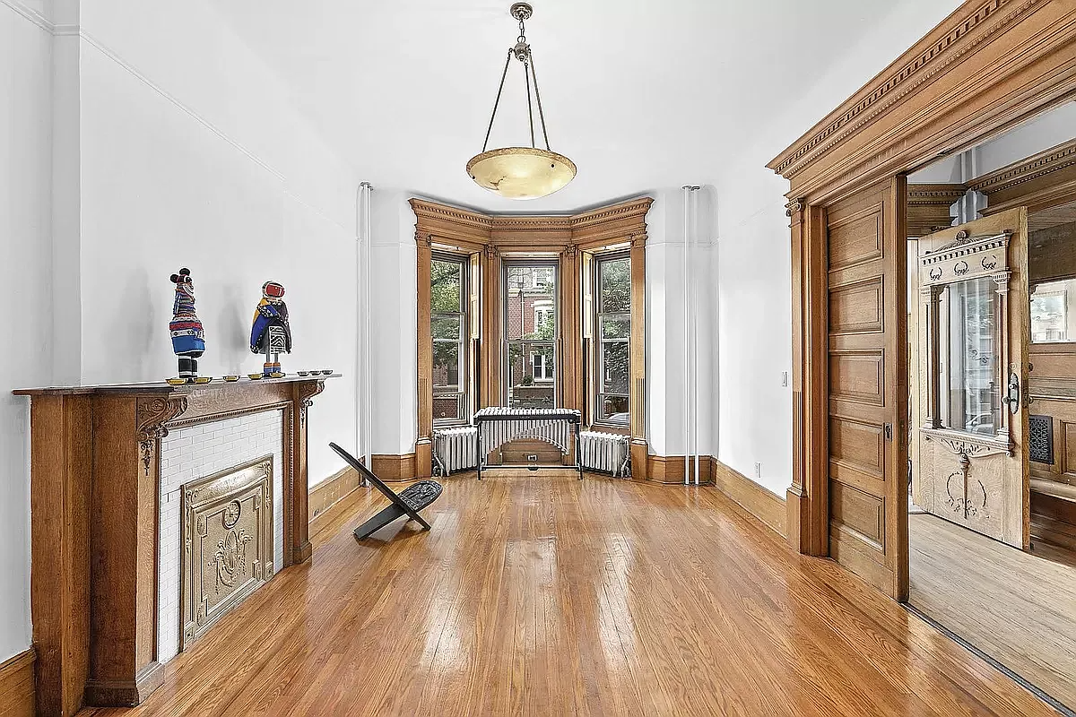 parlor with mantel and woodwork