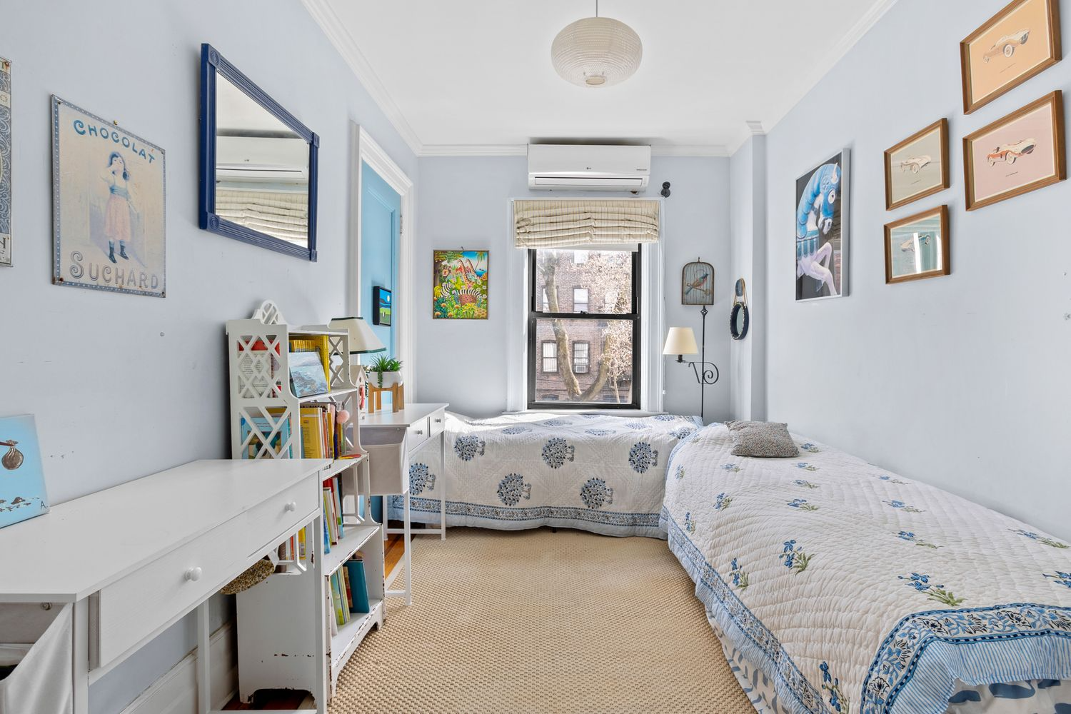 narrow bedroom with one window, wood floor