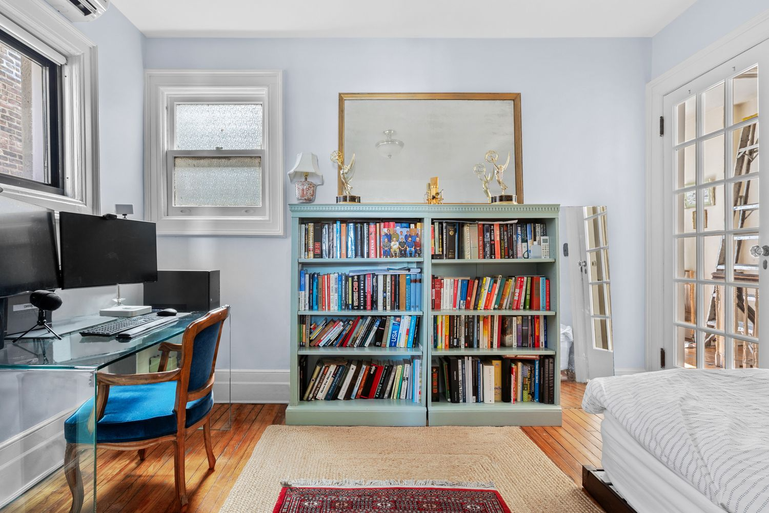 bedroom with two exposures, wood floor, set up as an office