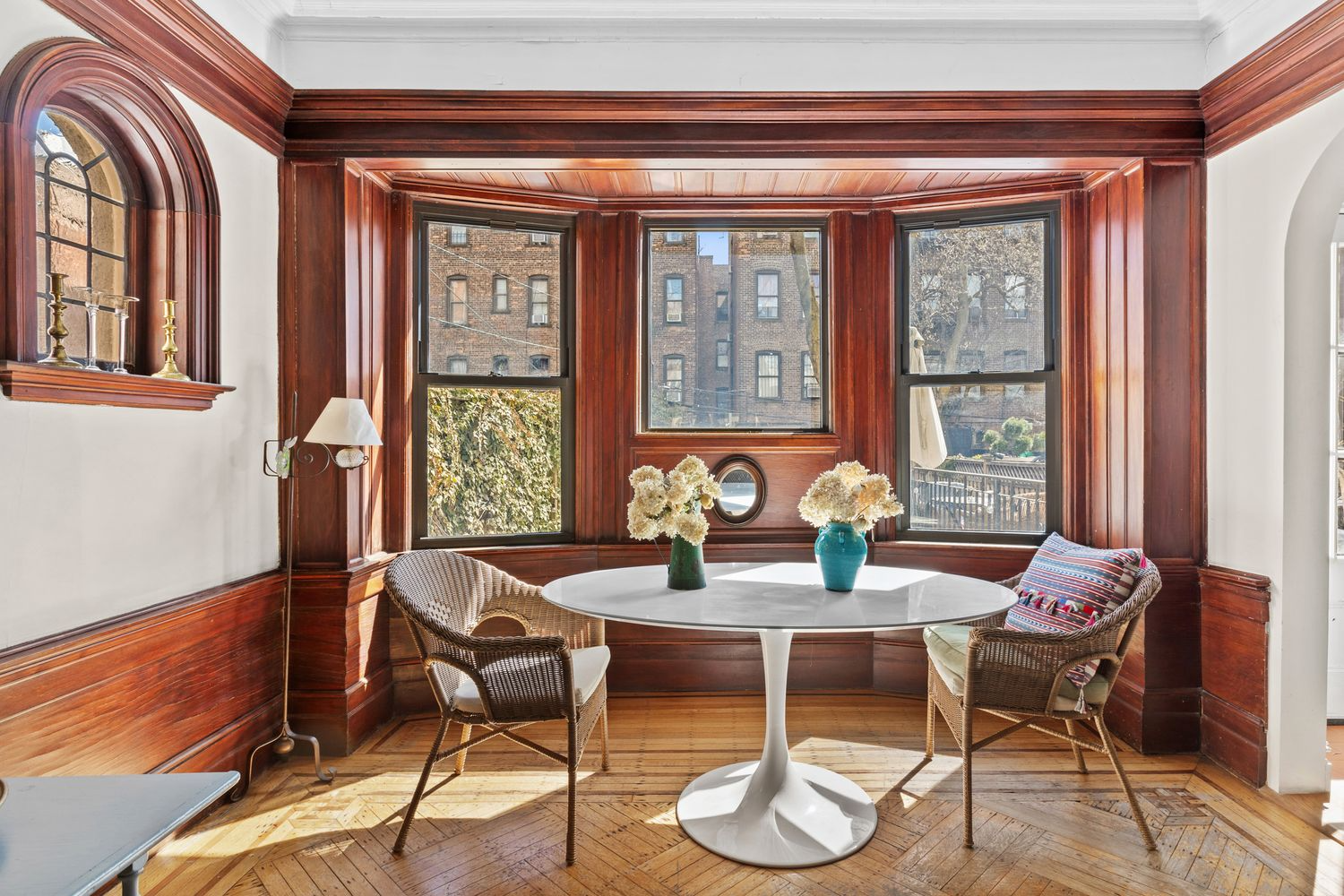 rear parlor with bay window, wainscoting