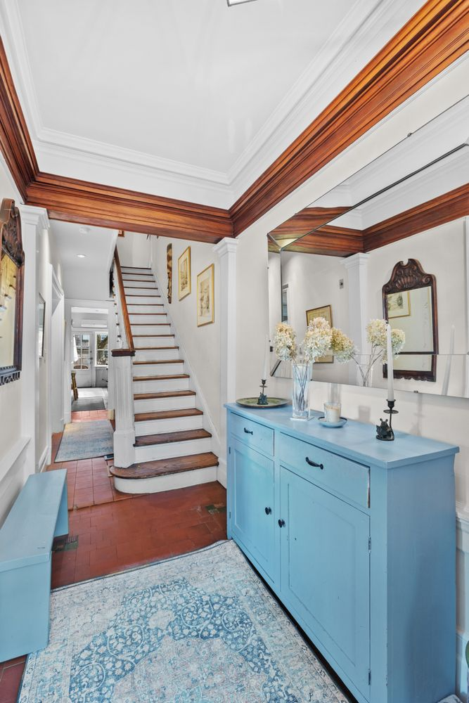 entry with tile floor, view to kitchen