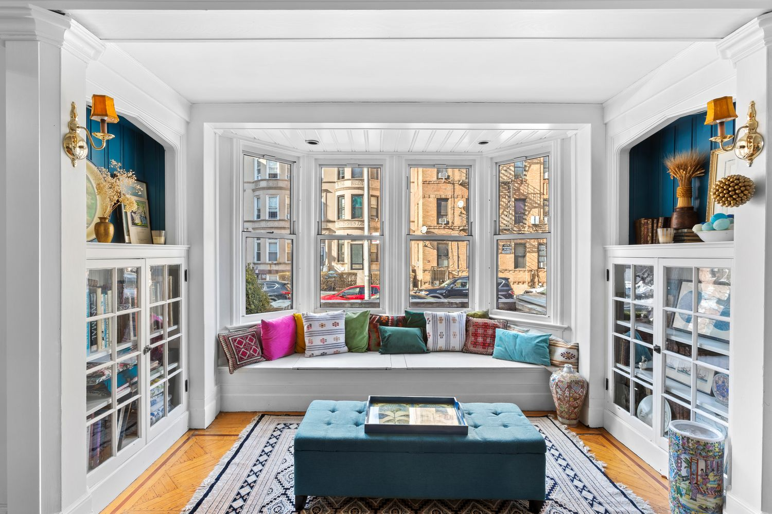 parlor with bay window, niches with bookcases