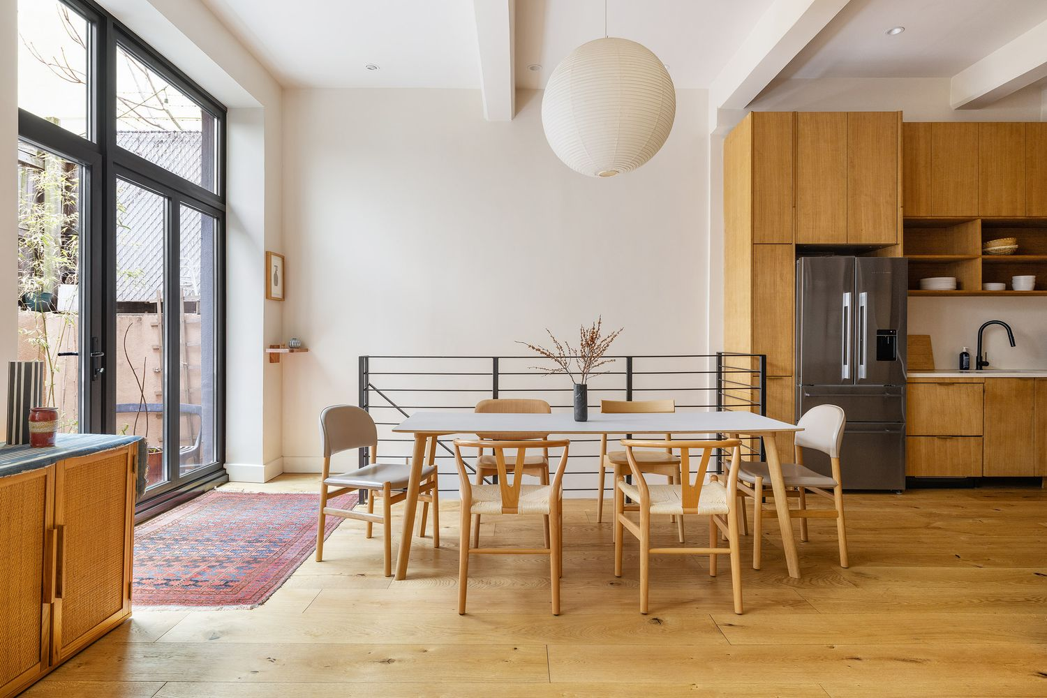 dining area with wall of windows, door to terrace