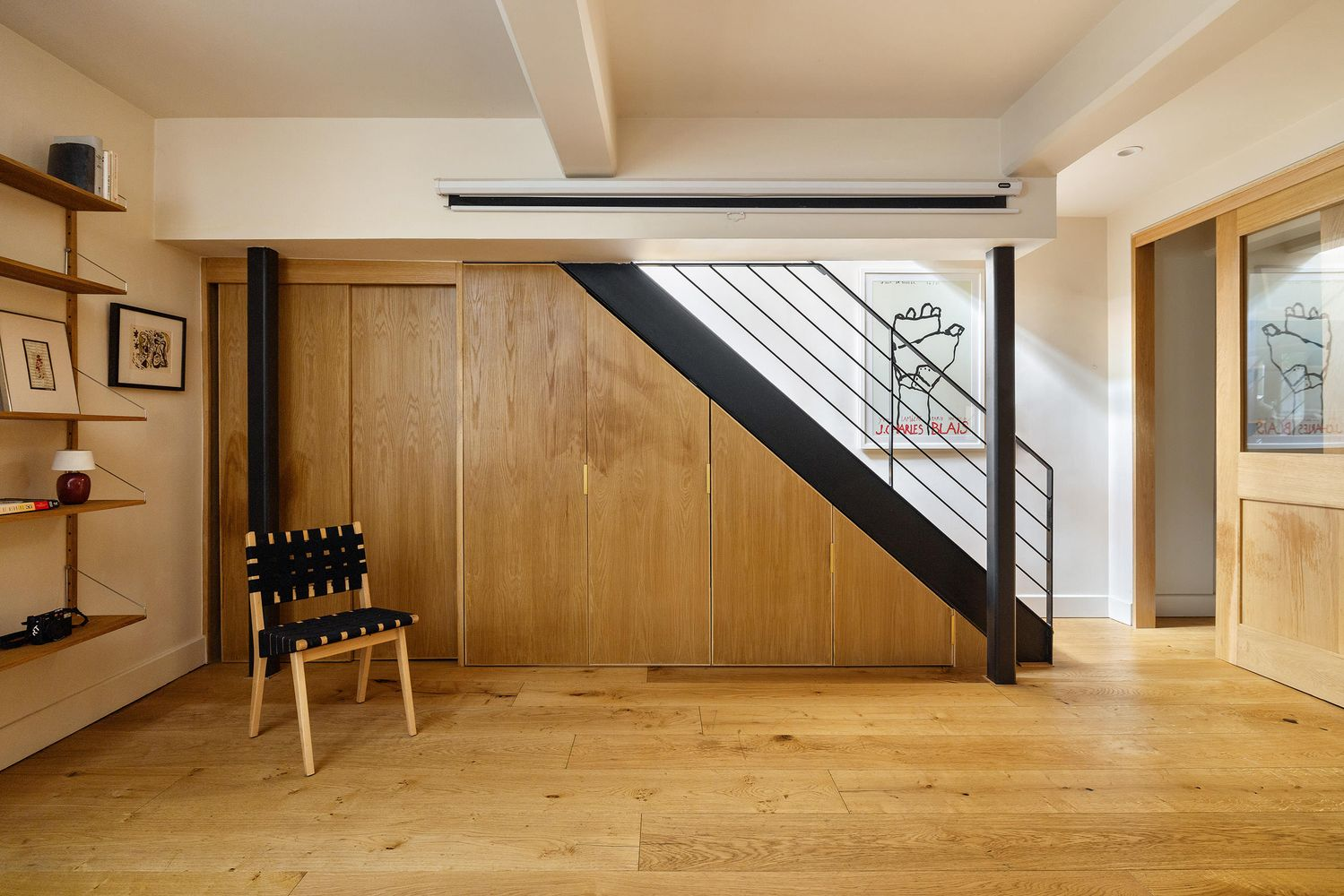 staircase with wall of storage underneath