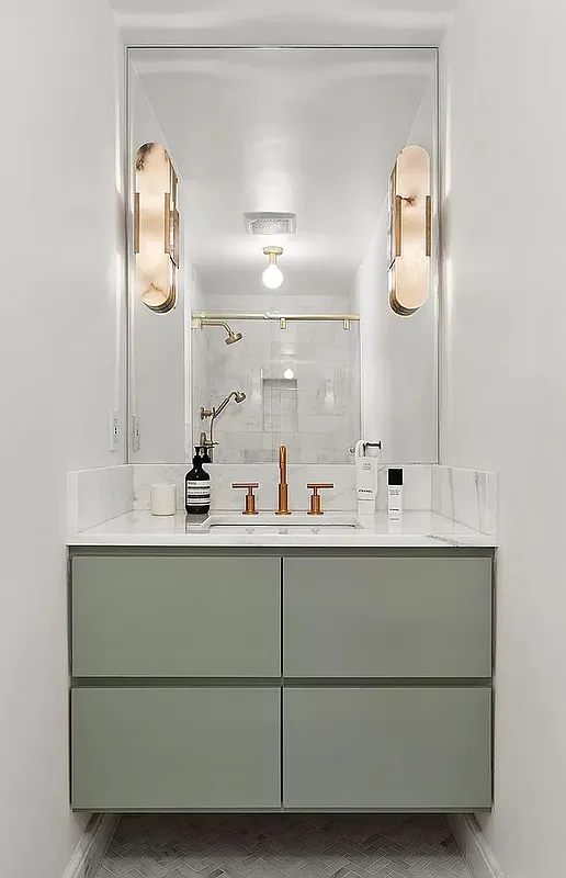 pale green vanity with large mirror