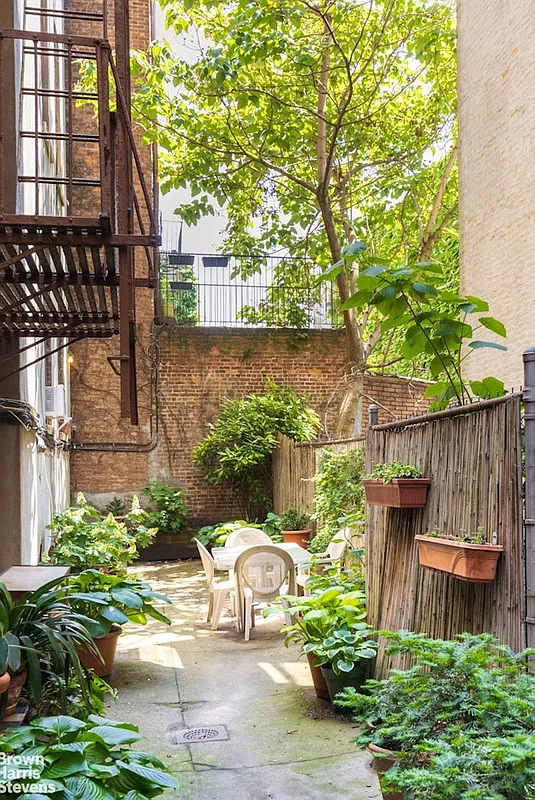 rear yard with paved patio with seating