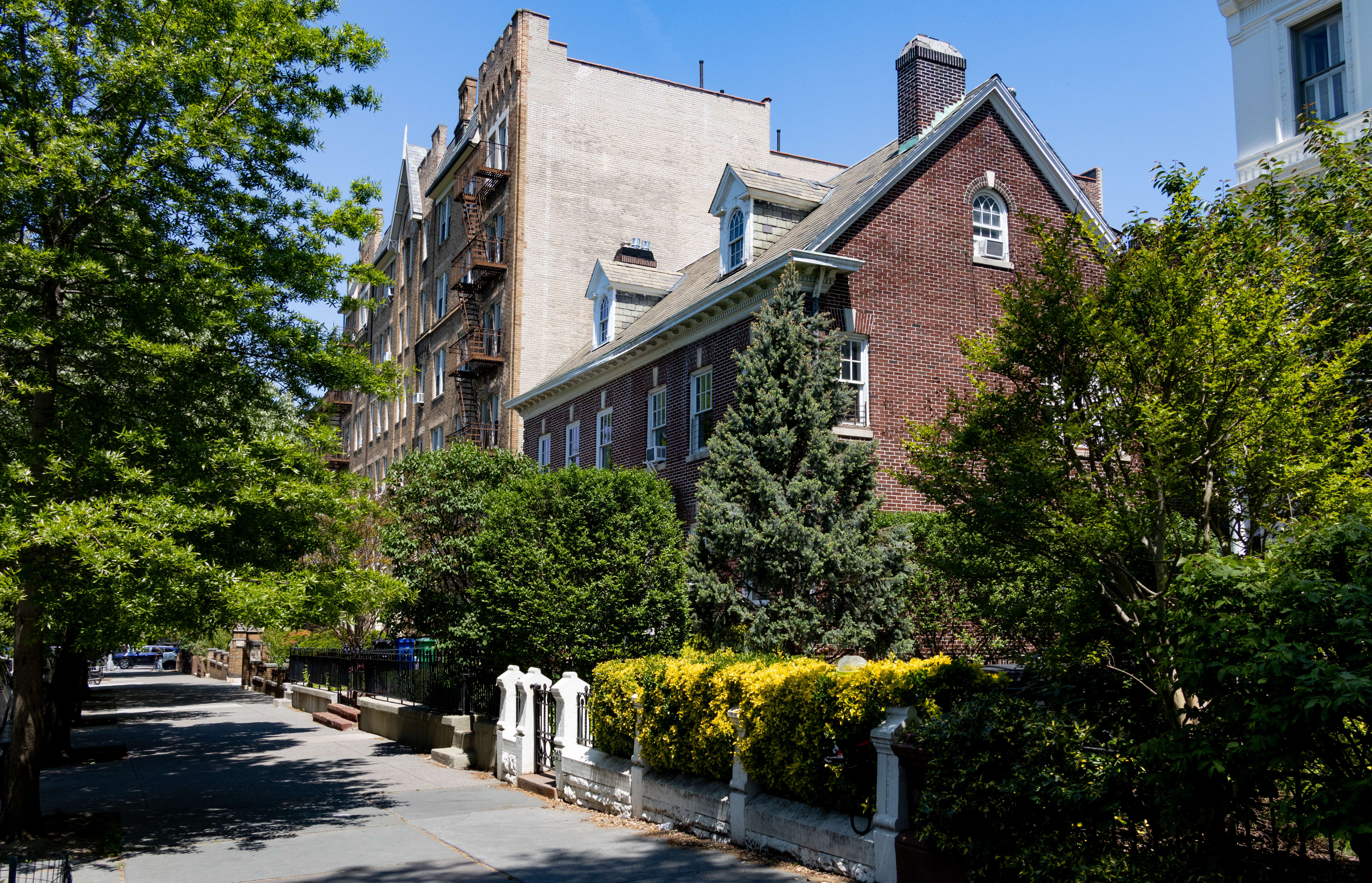 brooklyn streetview with a brick house and a brick apartment building