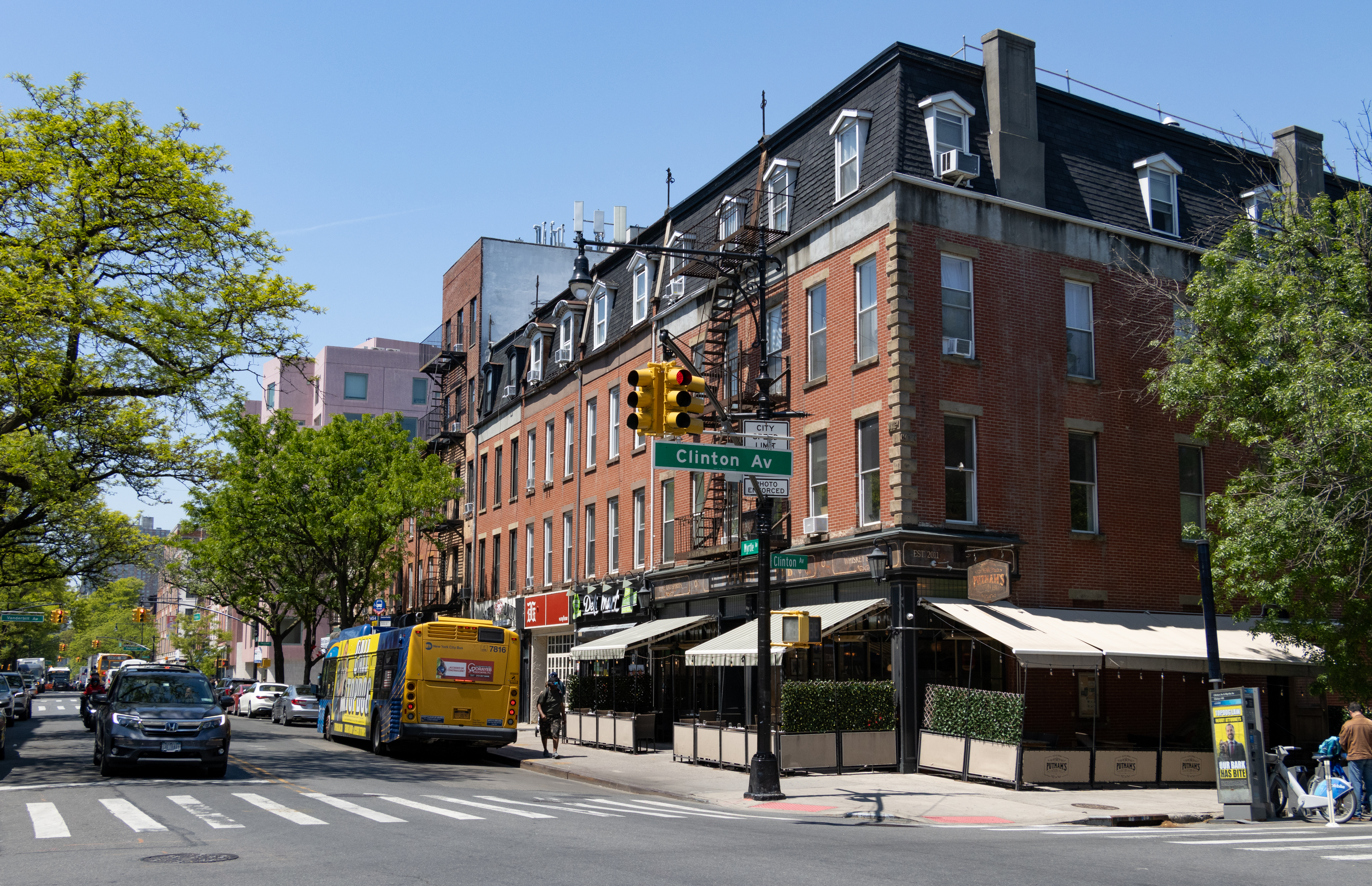 brooklyn- streetview with vehicles and pedestrians with brick buildings